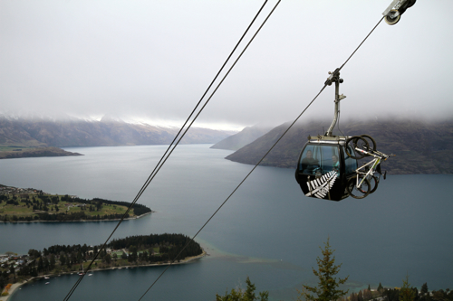 Scarlett and Ross ride the All Black gondola to the top of the Queensotwn Bike Park